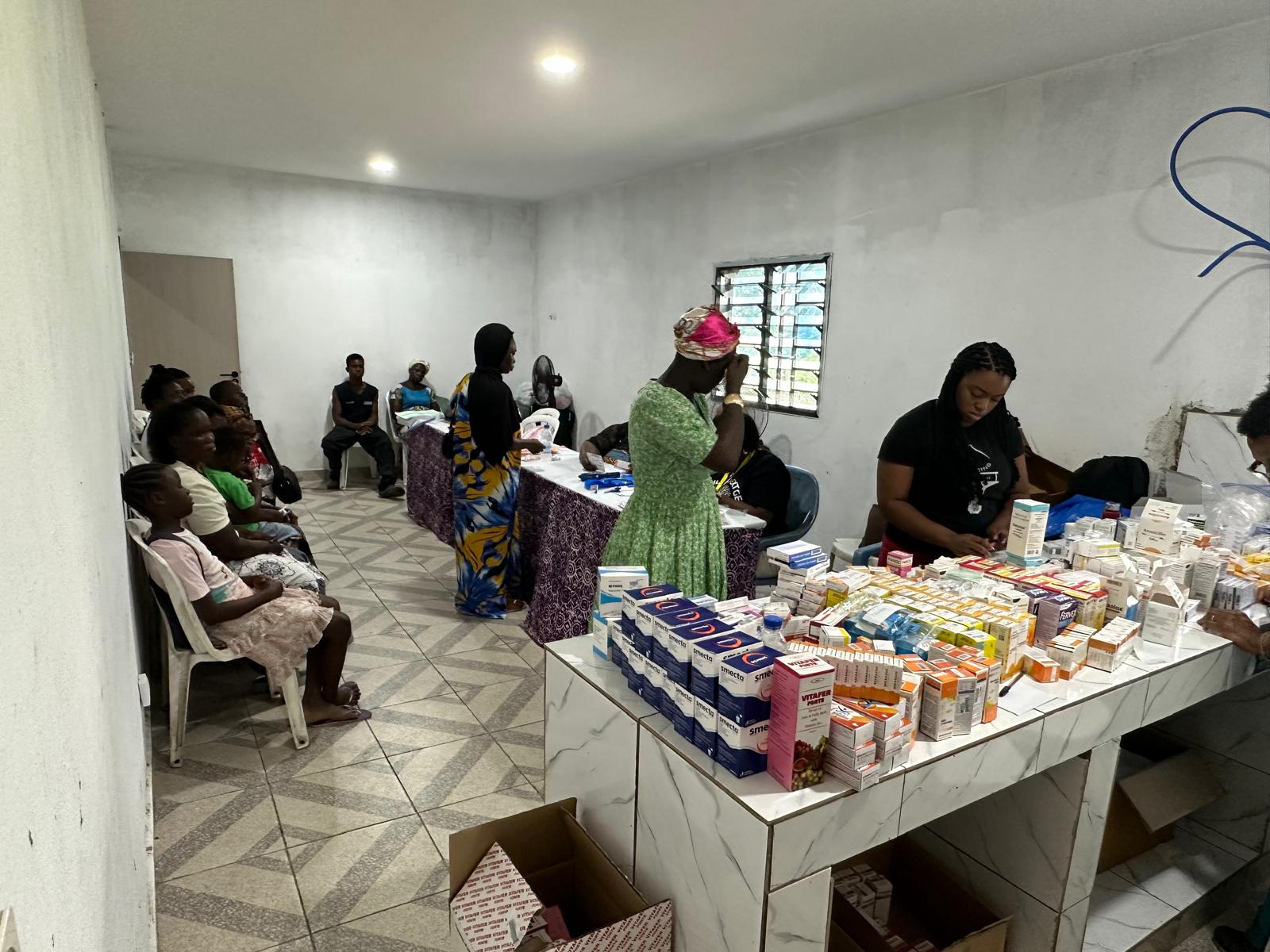 Volunteers at the pharmacy table