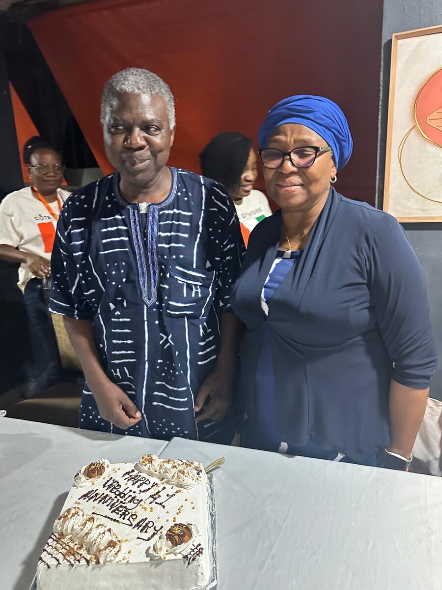 Pelu and Titi Adewale with their anniversary cake in Abidjan